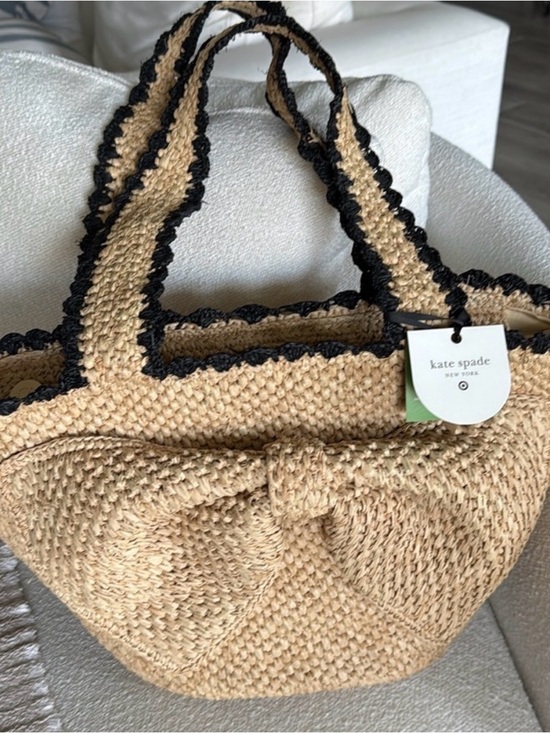 kate spade Handbags - kate spade natural straw tote with black trim and bow